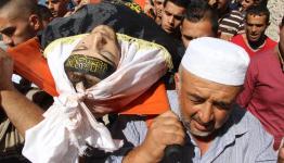 الشهيد التلاحمة محمولاً على الأكتاف 