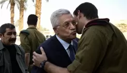 عباس وقبلات التنسيق الأمني