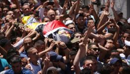 أثناء تشييع الشهيد محمد الكسبة