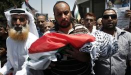 أثناء تشييع الشهيد الطفل علي دوابشة