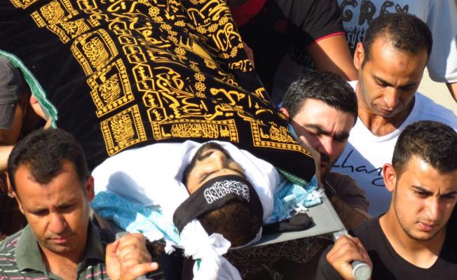 صورة لـ"مهدي أحمد حسنة" أثناء التشييع