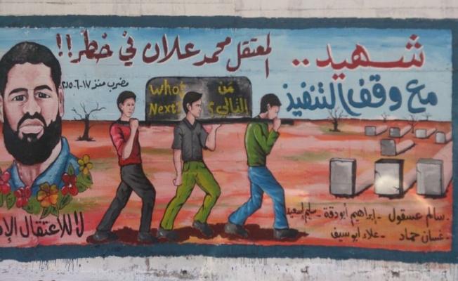 جدارية للأسير محمد علان