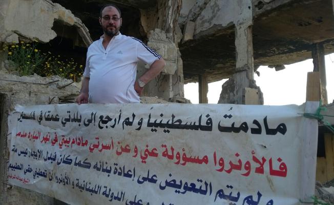 الشيخ عبد الله شرقية بجانب منزله المدمر 