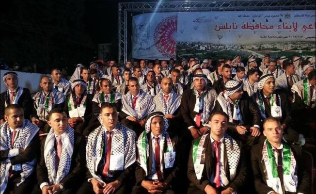 عقربا تزف 120 عريساً من الضفة