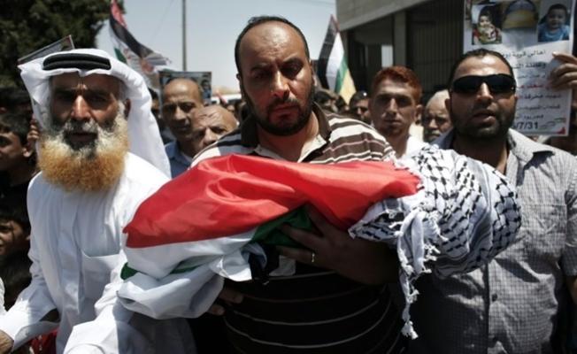 أثناء تشييع الشهيد الطفل علي دوابشة