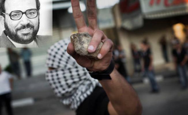 صورة منتفض يظهر خلفه الدكتور فتحي الشقاقي